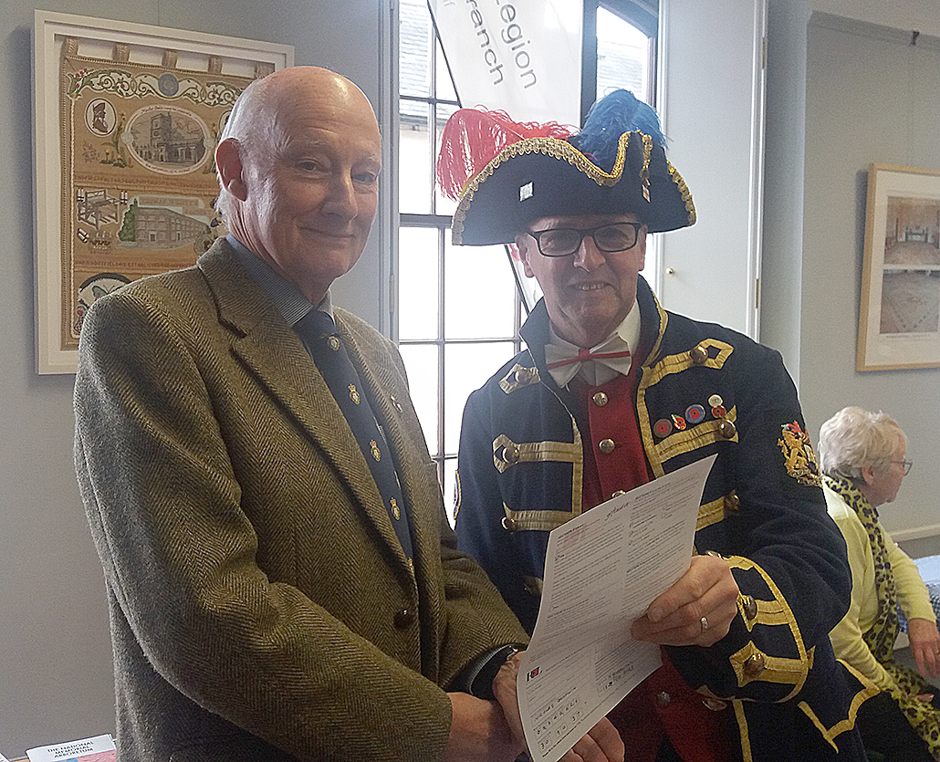 Legion chairman Peter Simon welcomes new member Nick Goodwin, Axminster's Town Crier