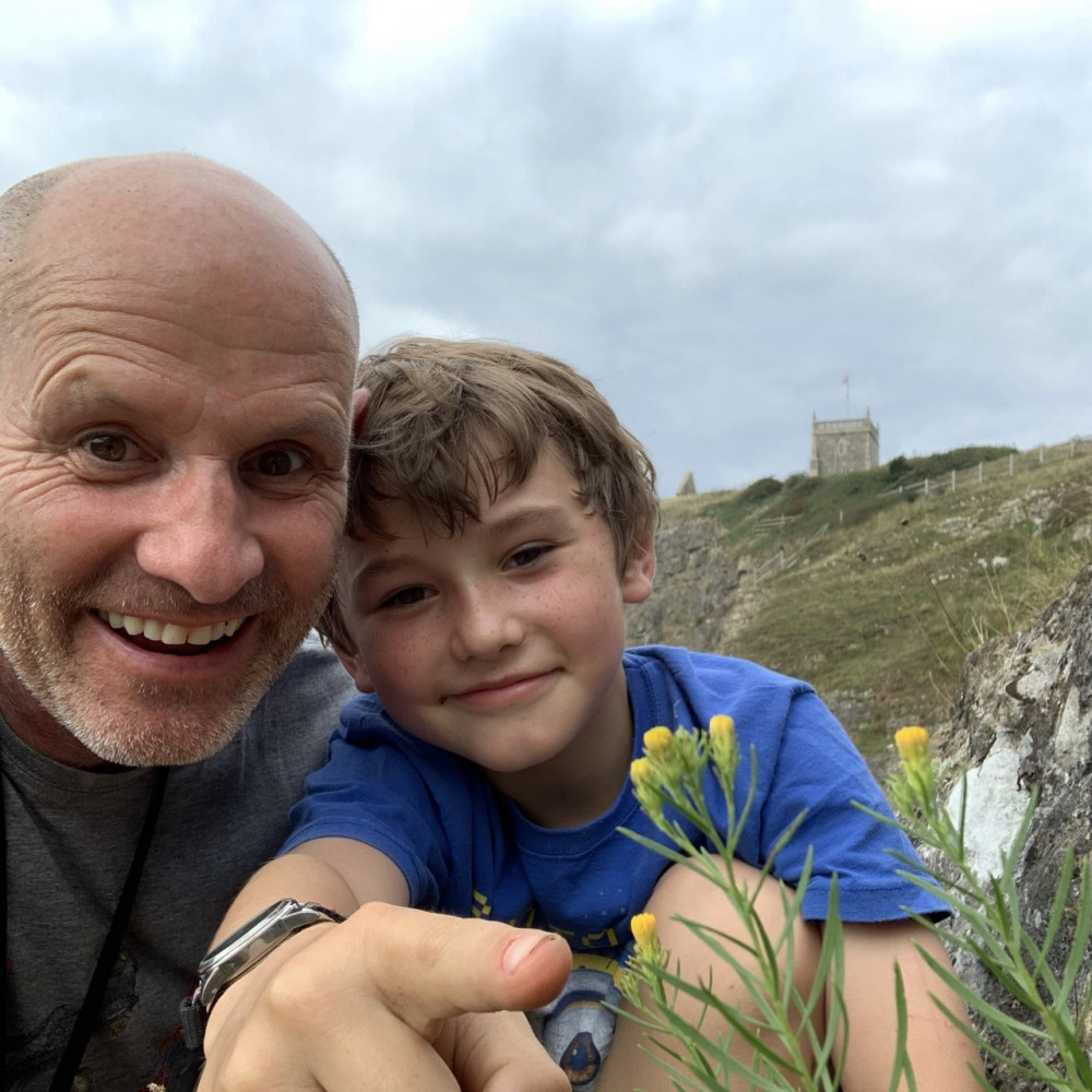 The BBC One Show’s wildlife reporter Mike Dilger with son Zachary as they discovered the 1,000th species of wild plants in a single year - a goldilocks aster