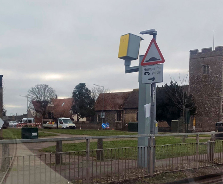 Workers from a traffic management company await completion of the works today when they will then remove the traffic lights. 