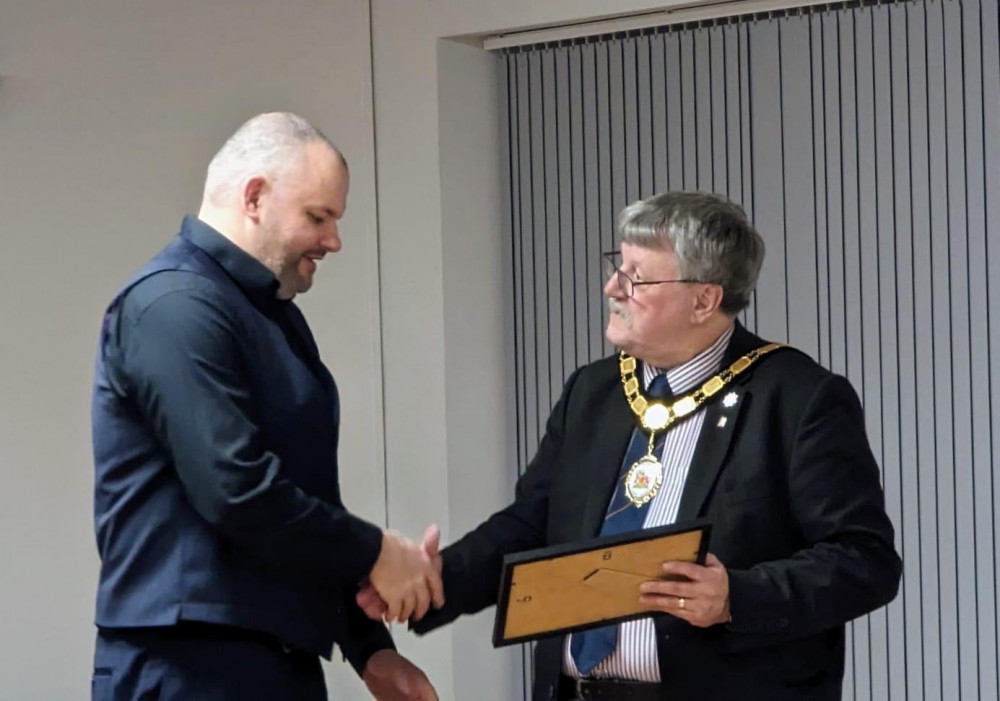 Dan Prettejohn receives his community award from Cllr Mike Best, chair of Somerset County Council