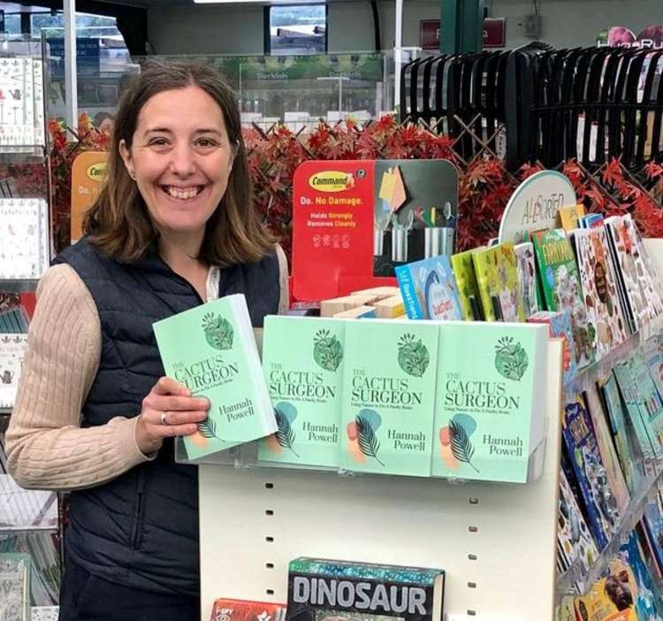 Hannah with copies of her book at Perrywood Garden Centre in Sudbury