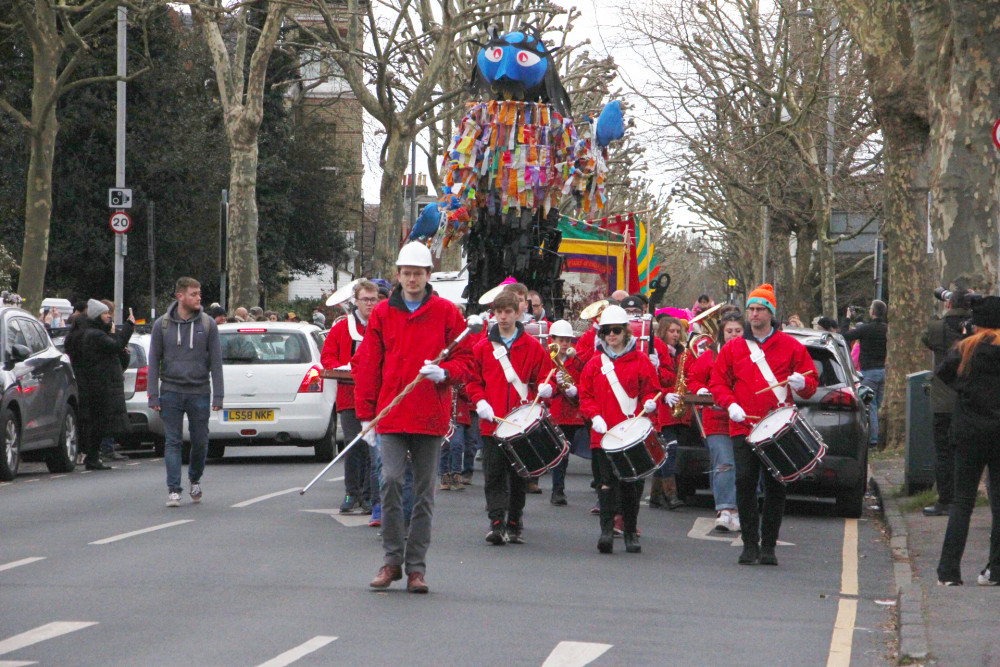 The Kingston and Malden Scout and Guide Band, followed by a huge colourful puppet of giant from local folklore, led the way in this year's Seething Festival parade (Credit: Guy Rofe) 