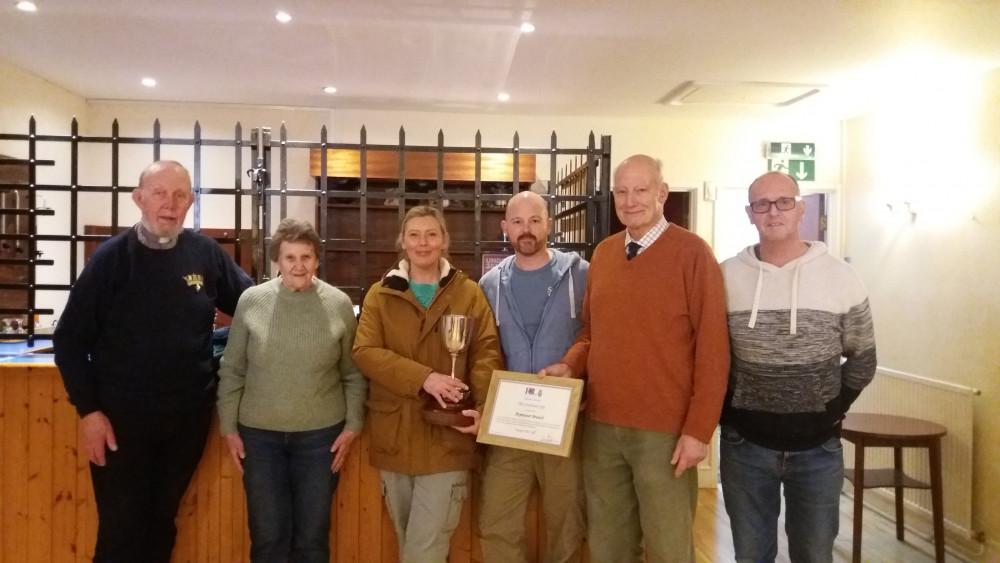 Pictured after the presentation of the Crediton Cup are (from the left): The  Reverend Geoffrey Walsh (chaplain and secretary), Mrs Wendy Graham, CPO Jo Ashkettle RN (vice- chair), Mr Lee Davis, Mr Peter Slimon (chairman)and Mr Nick Goodwin