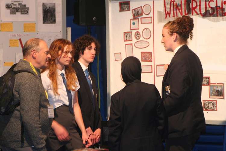 Guest judge Martin Spafford talking to year 11 students about their project