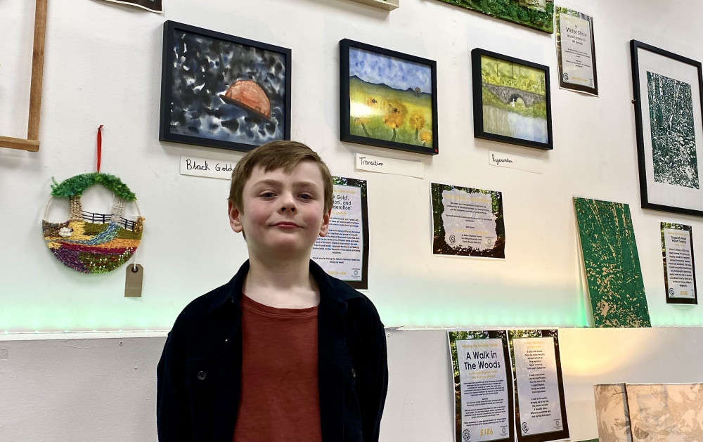 Louie Linstead with his three prize winning paintings that show the end of mining in Coalville through to the area's regeneration. All Photos: Coalville Nub News