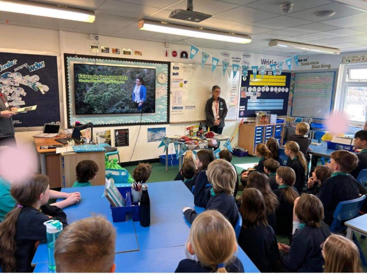 Joanne Lewis (Right) and Michael Trevaskis (Left) talking to the students about Fairtrade Fortnight.