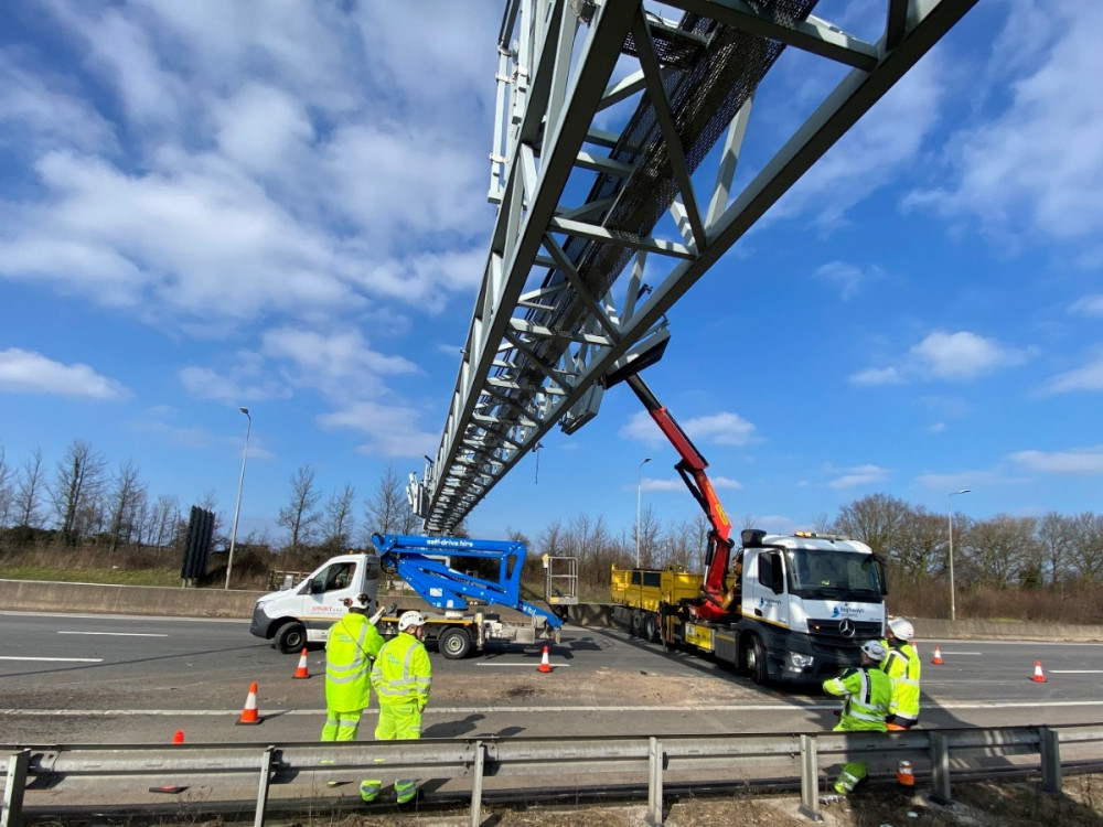 Work taking place to remove signage from the M5 gantry yesterday