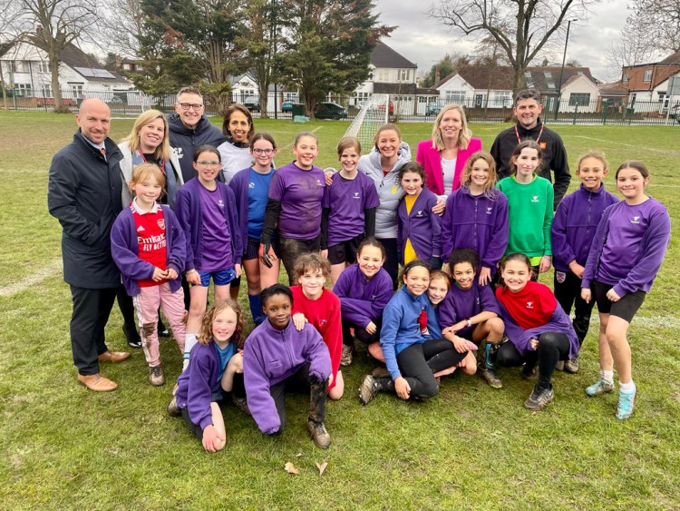 Heathfield girls football club alongside the Secretary of State for Education, Gillian Keegan and Twickenham MP, Munira Wilson (Image supplied)