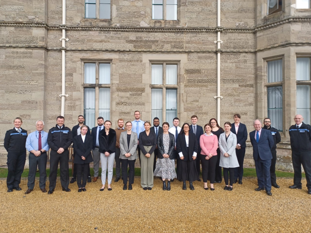 Commissioner Philip Seccombe and DCC Alex-Franklin with the new officers and members of the force’s learning and development team at the Leek Wootton headquarters (image via Warwickshire Police)