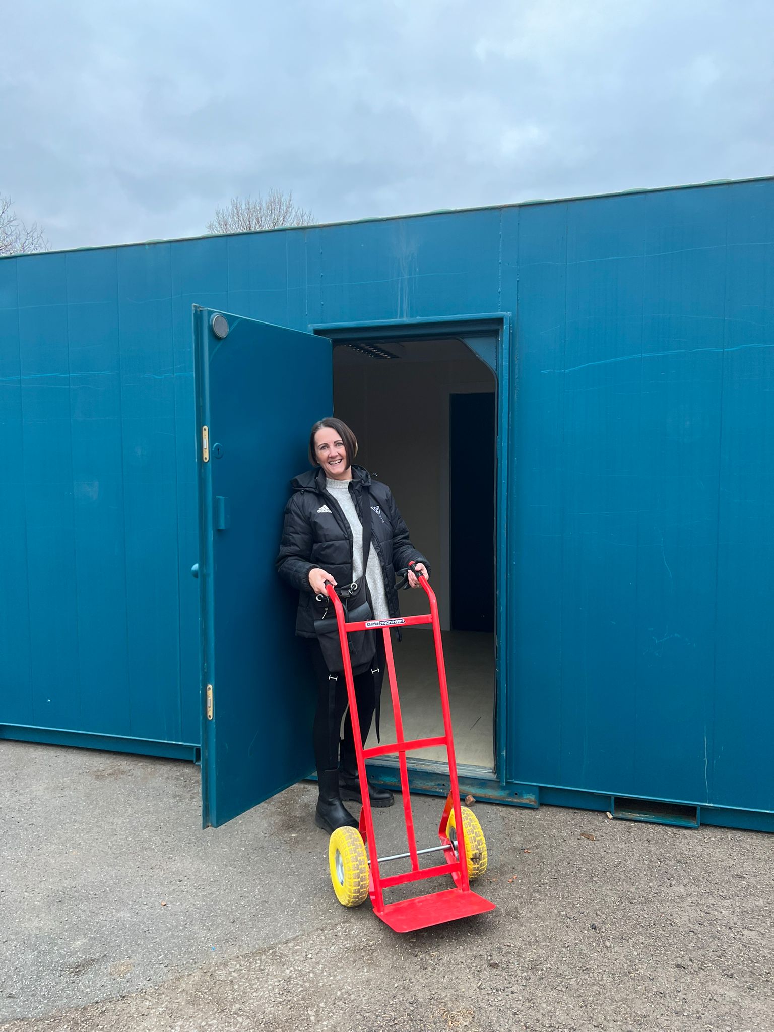 W4 Youth Founder Sally Chacatté unloading equipment 