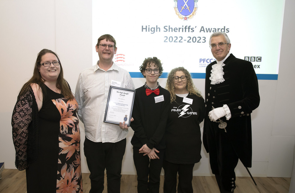 Sarah Troop (left) and Jay Gaffney (second from left) accepted the grant from Essex's High Sheriff (right) towards their local youth initiative. (Photo: Steve Brading / Essex Community Foundation)
