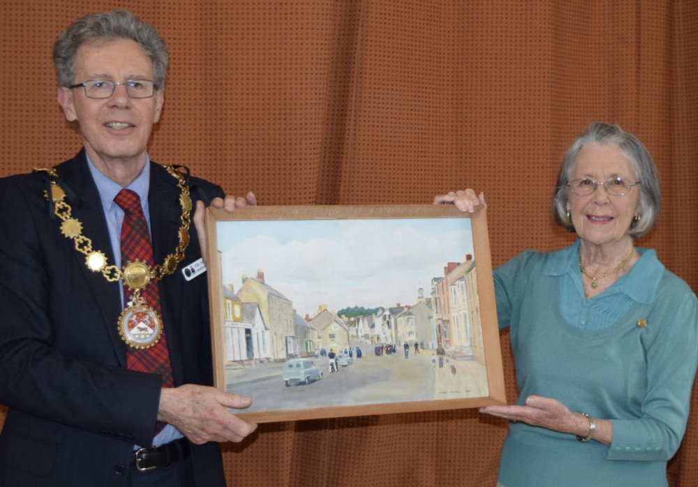 Mary Bird presented Cllr John Andrew with a painting of Cowbridge Mayor’s Sunday 1963. 