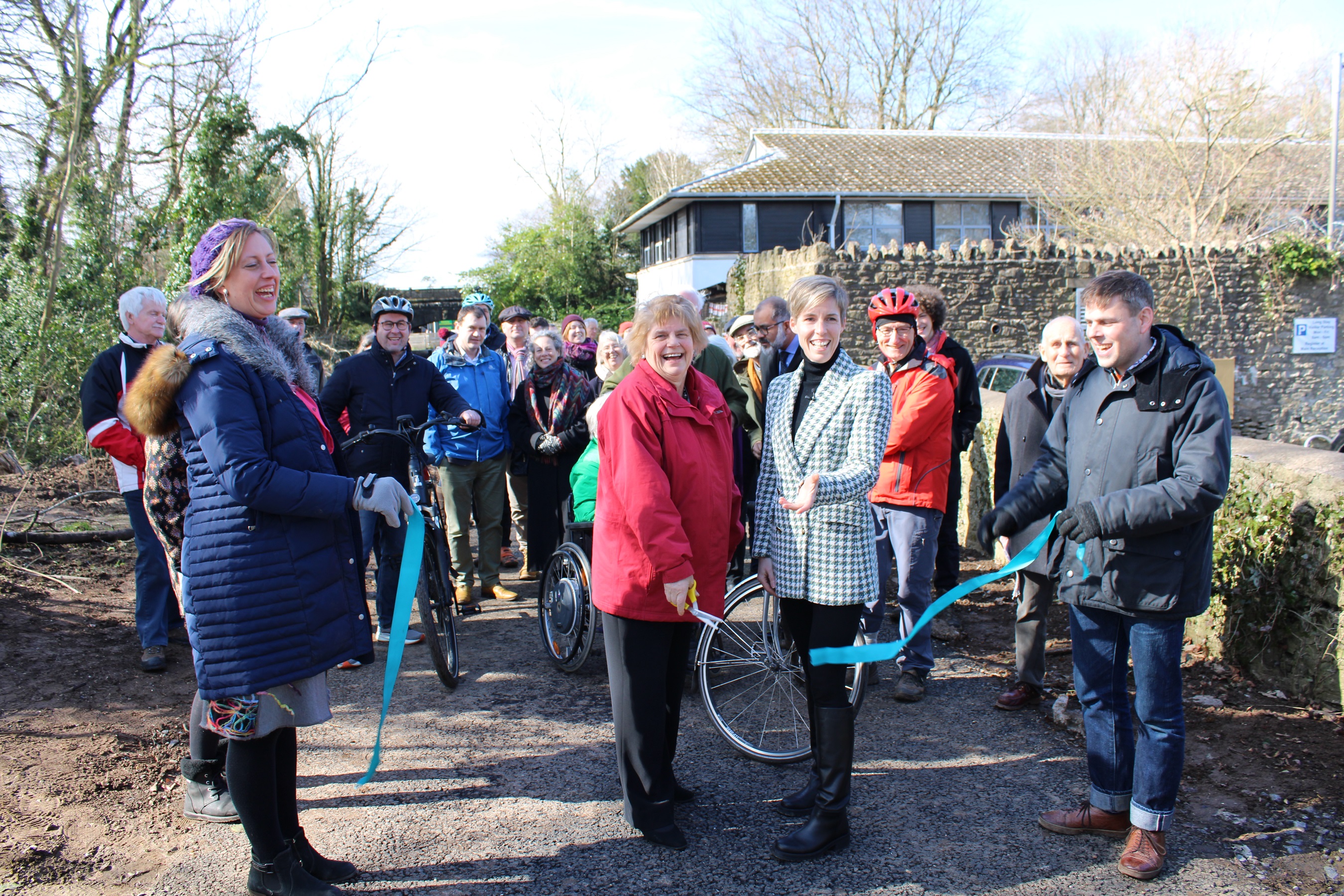 Leader of Mendip District Council, Cllr Ros Wyke cutting a ribbon to declare the path open.