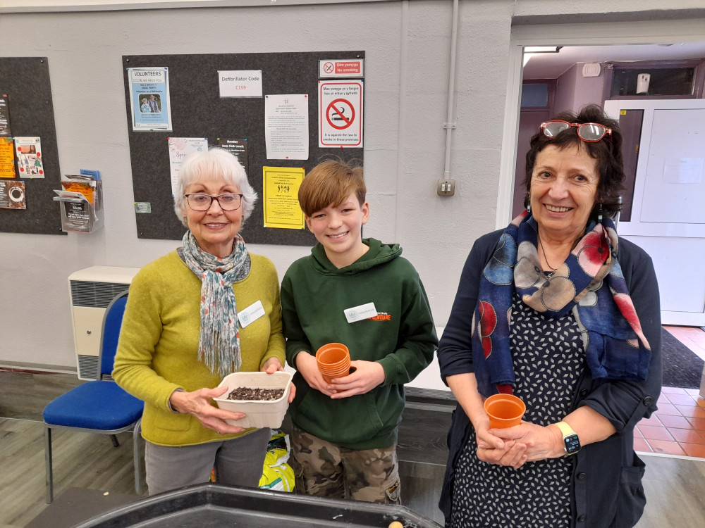 Barbara Daniels, Jack and Councillor Anne Asbrey handing out free seeds