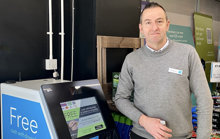 Ashby Co-op store manager Richard Walton with the new in-store cash machine. Photos: Ashby Nub News