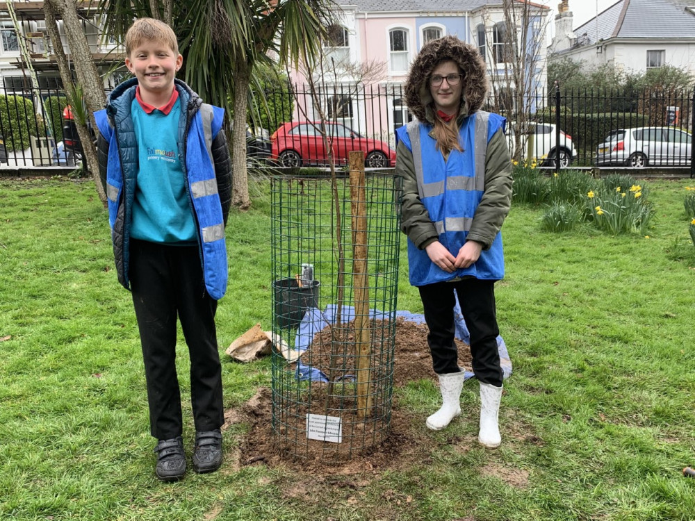 Dylan and Lily-May with planted tree. Dylan and Lily-May with planted tree.