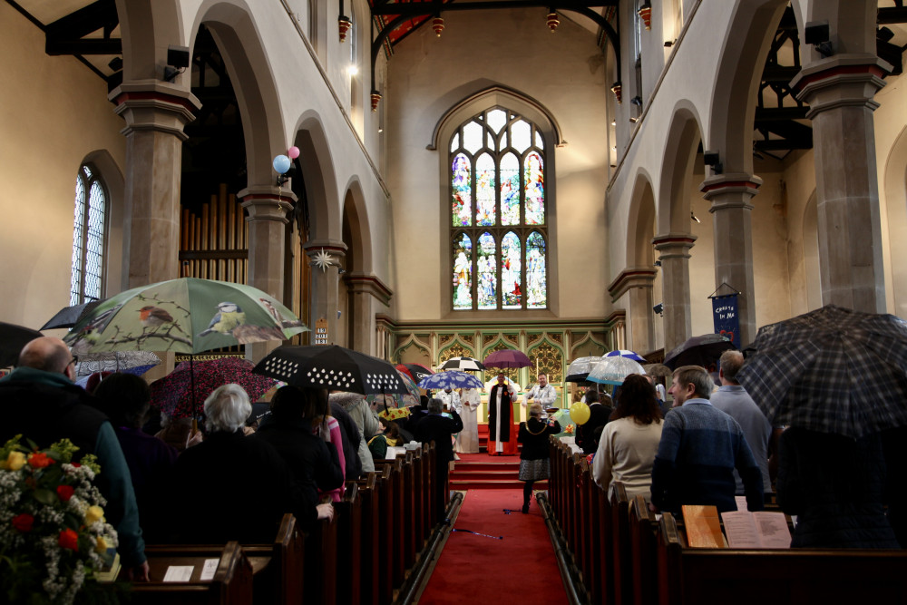 The Victorian-era roof needs fixing for the next 200 years. Churchgoers brought brollies into a recent service to raise awareness for the new campaign. 