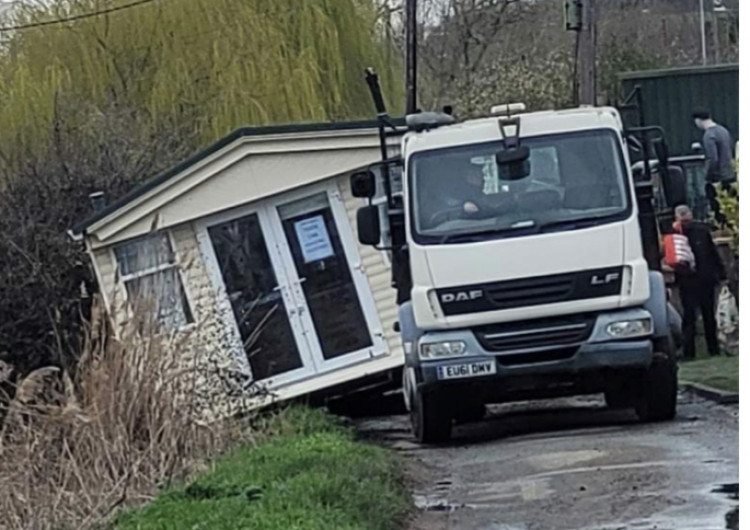 Oops. Home slips into ditch in delivery accident 