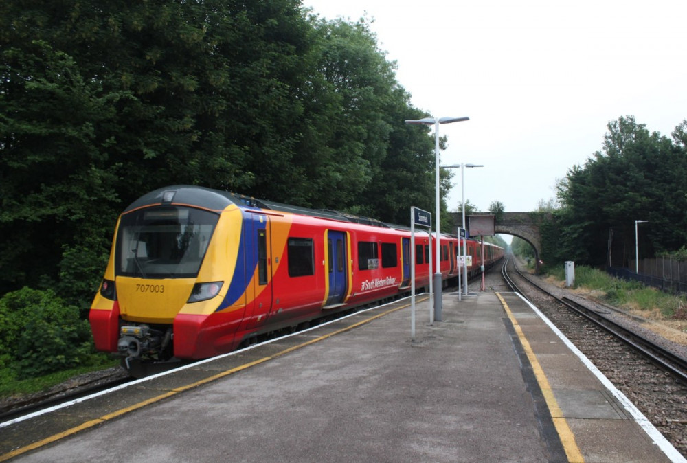 South Western Railway train accelerate away from Sunnymeads station on their way to London Waterloo. Photo: Geof Sheppard.