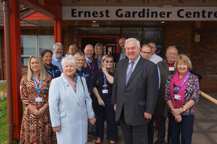 Pictured with members of the Garden House Hospice Care Care team and patients are Pam Burn (ex-Chair of the Heritage Foundation) Steve Mellish (Chair of Garden House Hospice Care) Graham Fisher (CEO Heritage Foundation) Gareth Hawkins (Chair Heritage Foundation) and Sir Oliver Heald MP