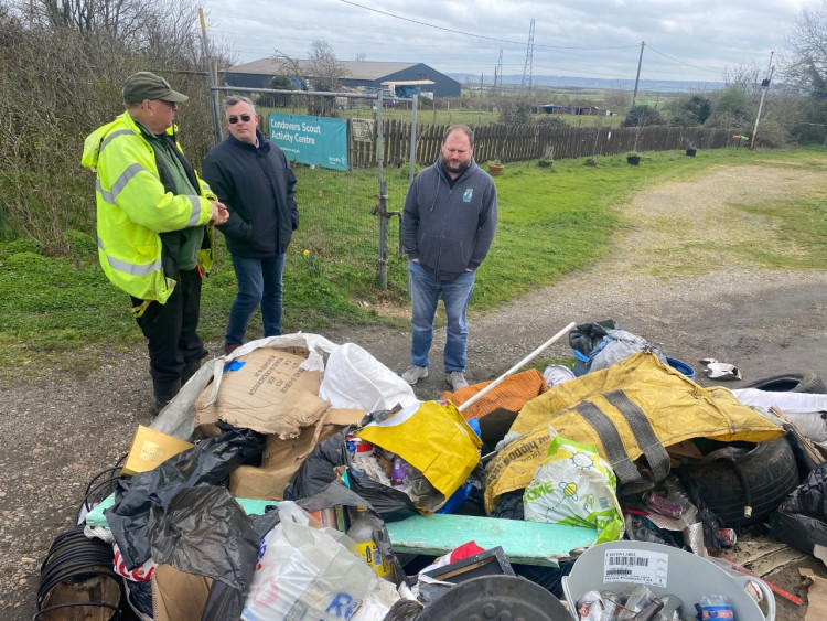 Scouts officers Lawrence Key and Geoff Harris with Cllr Fraser Massey at the fly-tip at Condovers.  