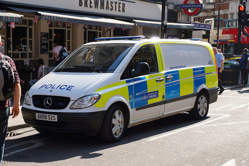 Police push police van 10km to raise money for charity. Photo: Chris Sampson.