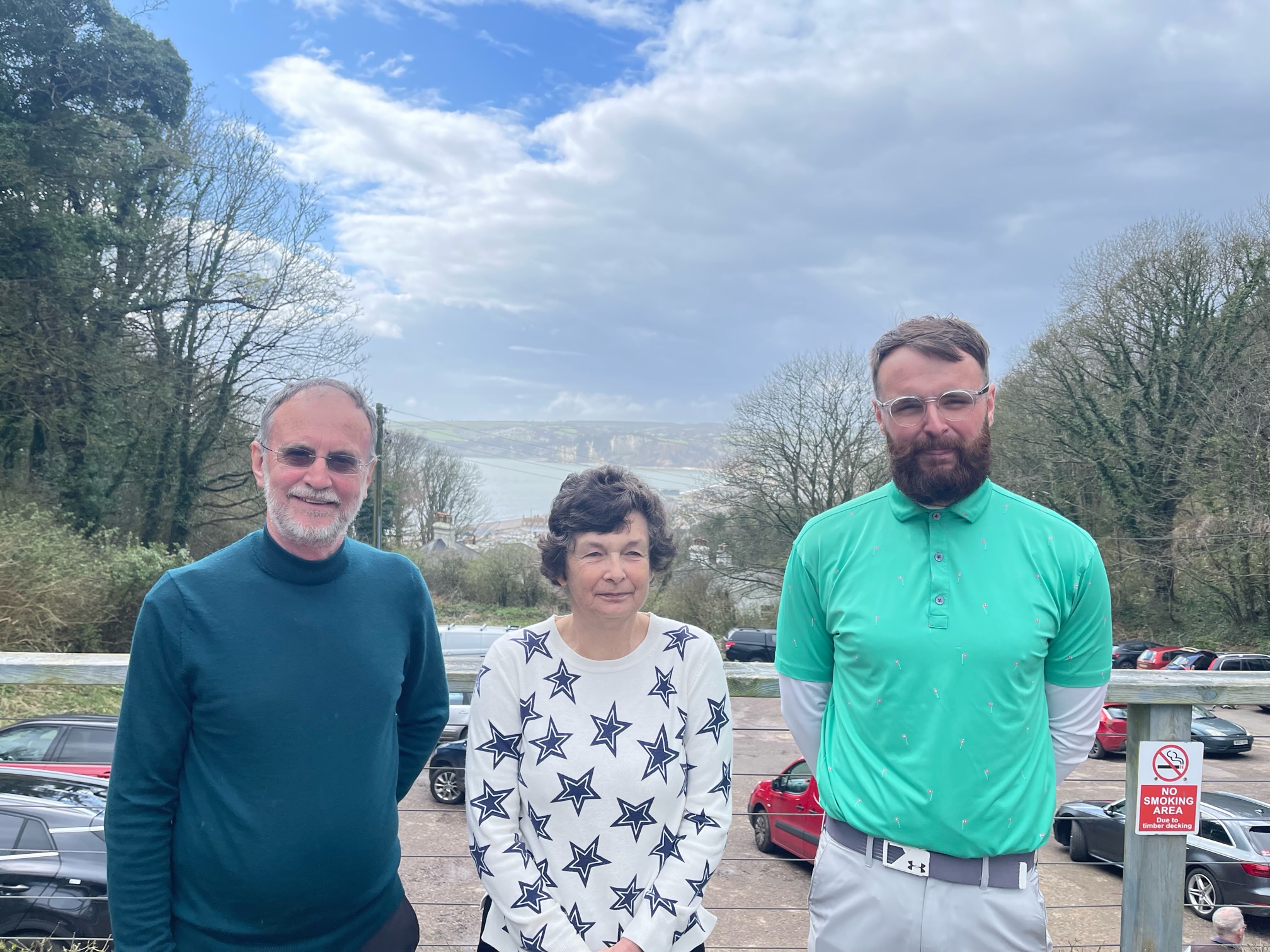 The 3 Captains on the first tee with Steve Thompson on the left separated by Stella Thompson and Harvey Gibbons on the right. Photo by Alex Taylor