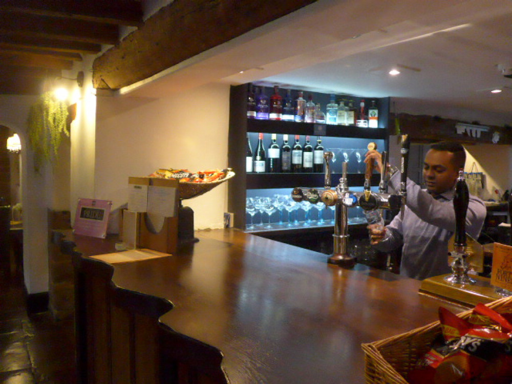 The team working hard to pull the perfect pint at The Marquess of Exeter. Image credit: Homera Wood, Vice Chairman of Rutland CAMRA.