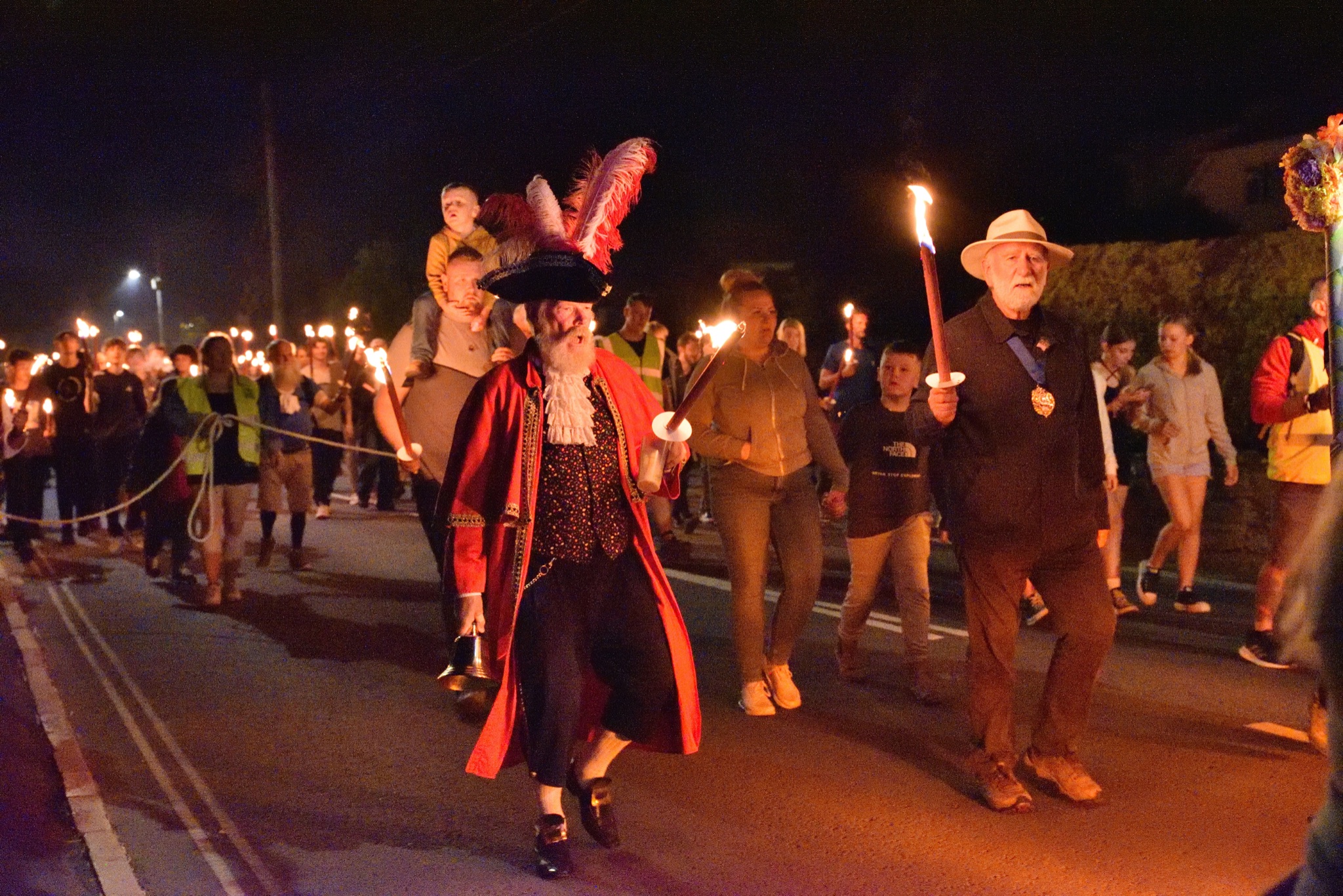 The popular torchlight procession will be returning this summer