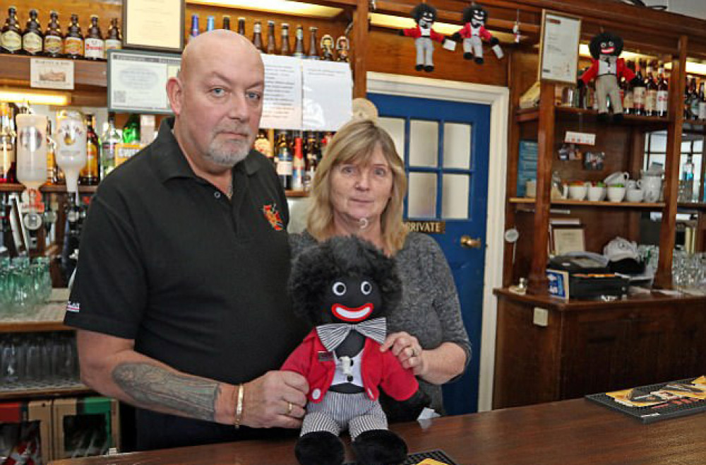 A black and white problem? Police officers visit pub to confiscate 'Golly' dolls despite force having previously decided no laws were broken. Council confirms display does not breach its rules