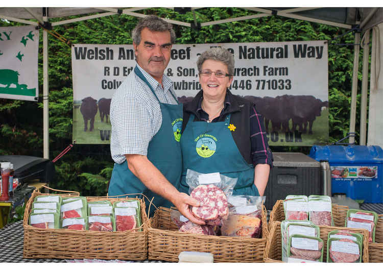 Myfanwy Edwards and her husband at the Cowbridge Farmer's Market (Image via The Food Collective.com)