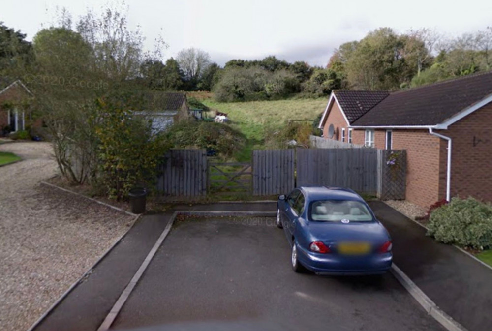 The homes would be built on land to the west of Down Close (Google Maps)