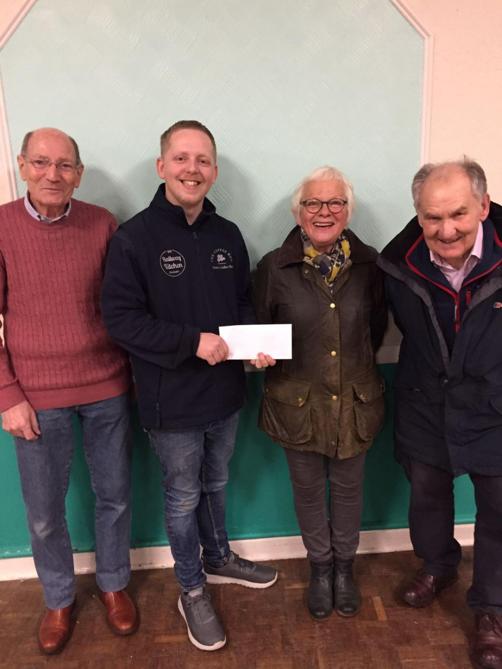 Jack Price (second from left) of The Railway Kitchen with members of Axminster Carnival Committee