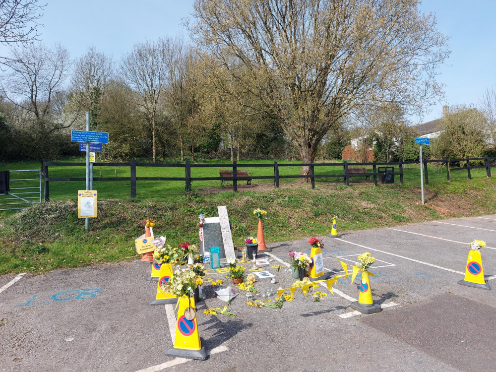 The flowers and tributes still pile up at the spot Charley Bates was stabbed to death 