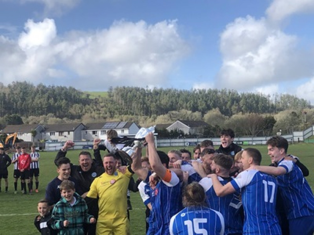 Helston lift the trophy (Image: Cornwall FA)