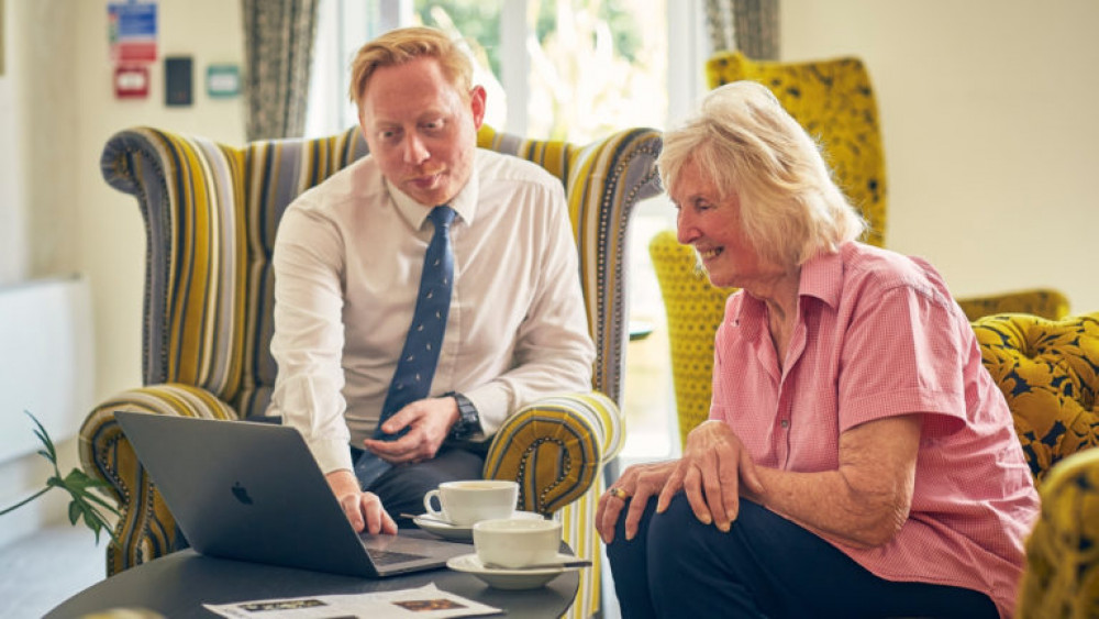 Adlington Retirement Living homeowner, Joan, with Adam Tomlinson, general manager at The Chimes (Image - Adlington Management Services)