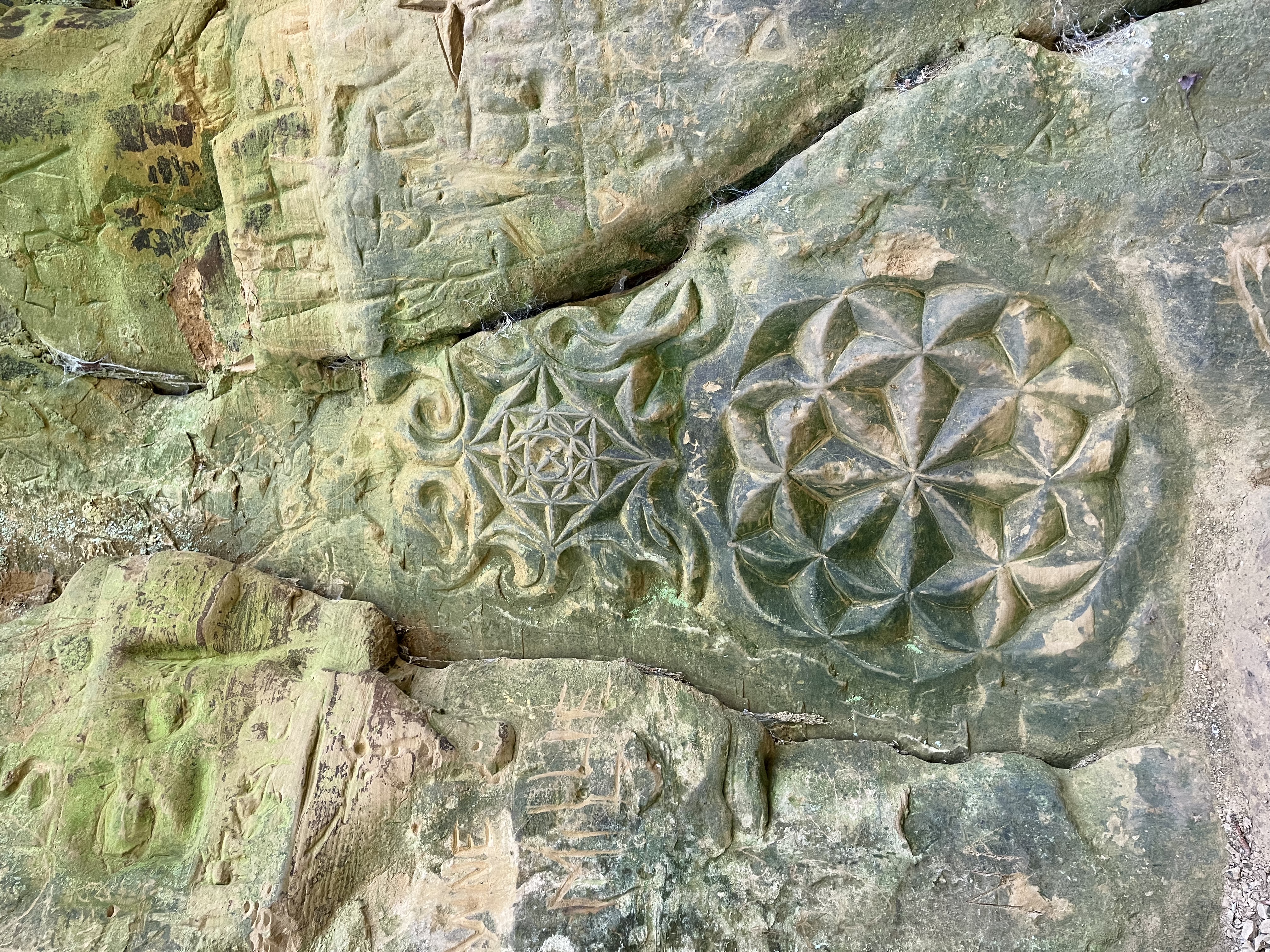 Carvings on the sandstone banks of Shute's Lane