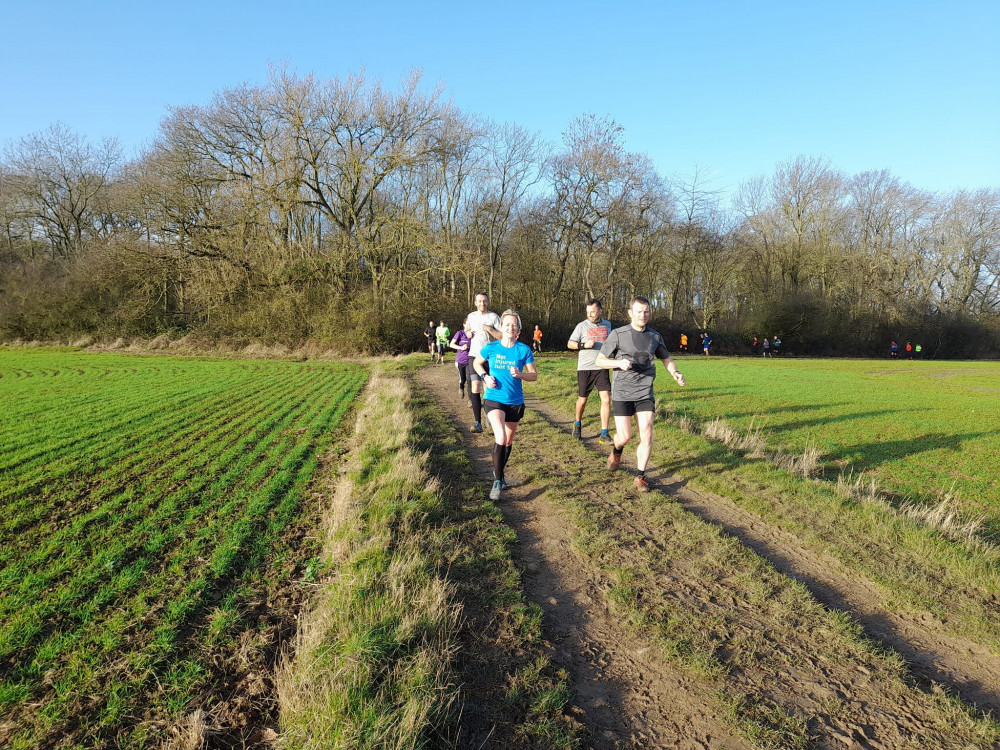 Laura out running the trails. Image credit: Bog Dog Running. 