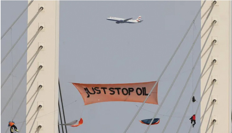 Two men have received jail sentences for their disruptive ascent of the QEII bridge. 