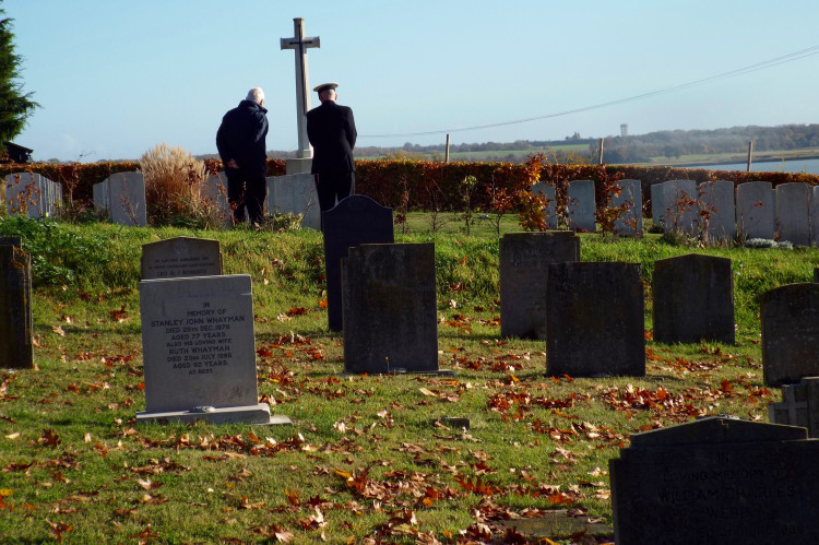 Respectful moment at Shotley War Graves