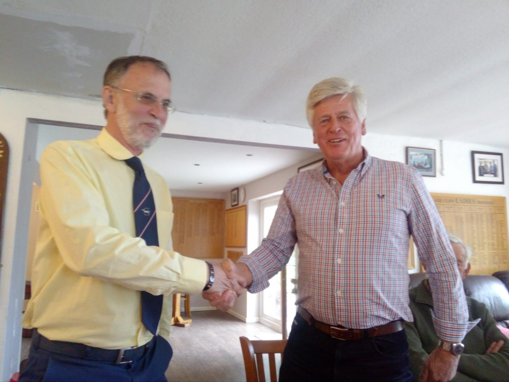 Seniors' Captain, Steve Thompson, on the left, congratulating his Bridport counterpart Alan Scutt at the dinner in the clubhouse after the match.
