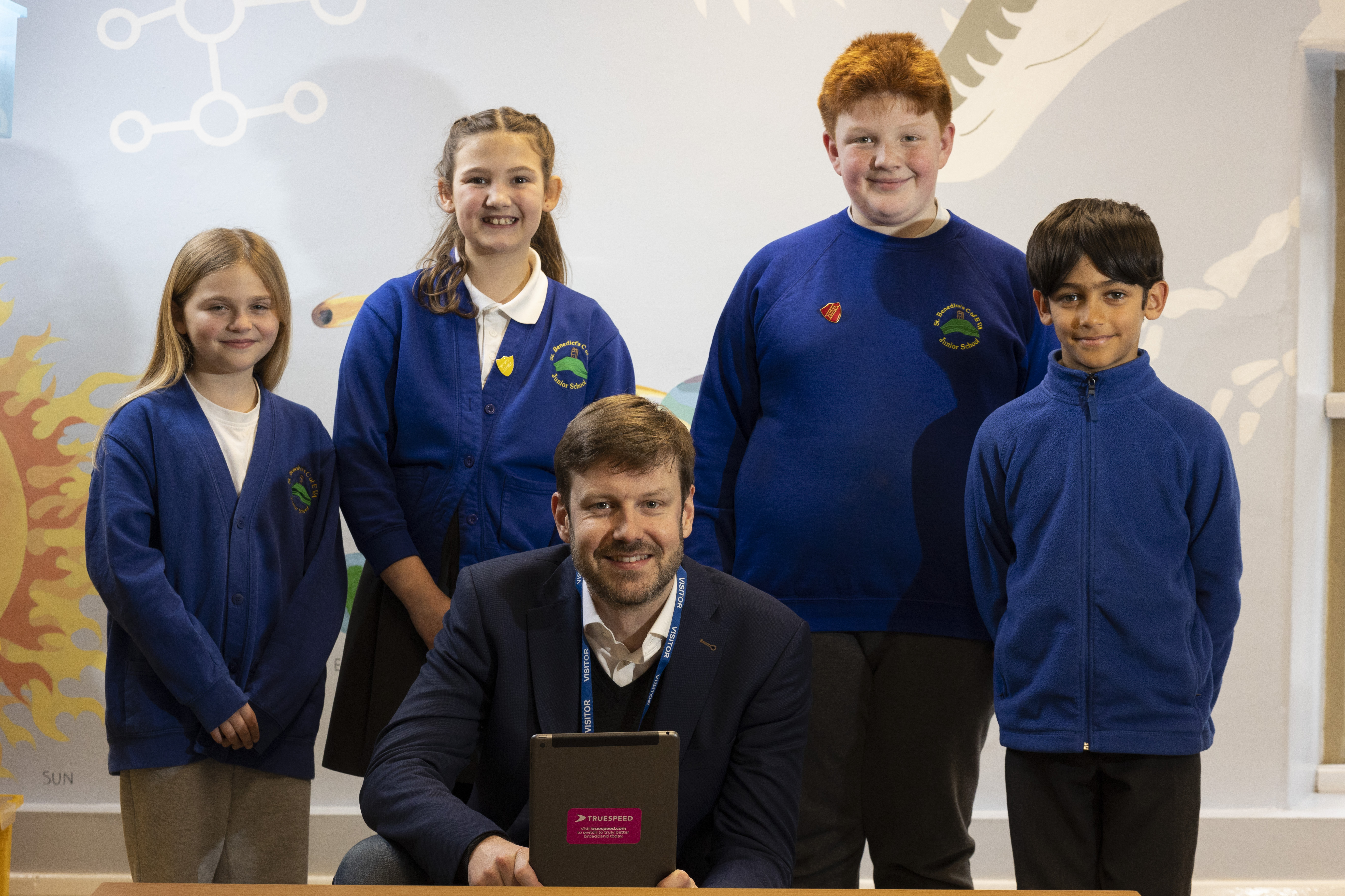 Truespeed CEO James Lowther with students from St Benedict's Junior School 