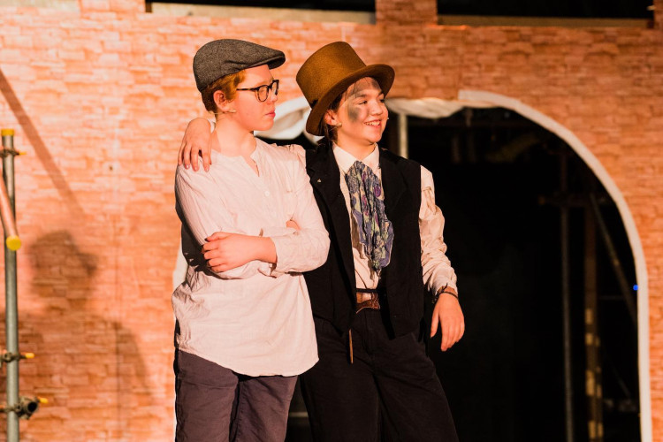 Iris Stephens (right) as the Artful Dodger in last year's Bridport Young Performers' production of Oliver