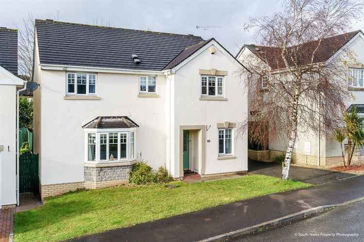 This four-bed family home is located in Ystradowen