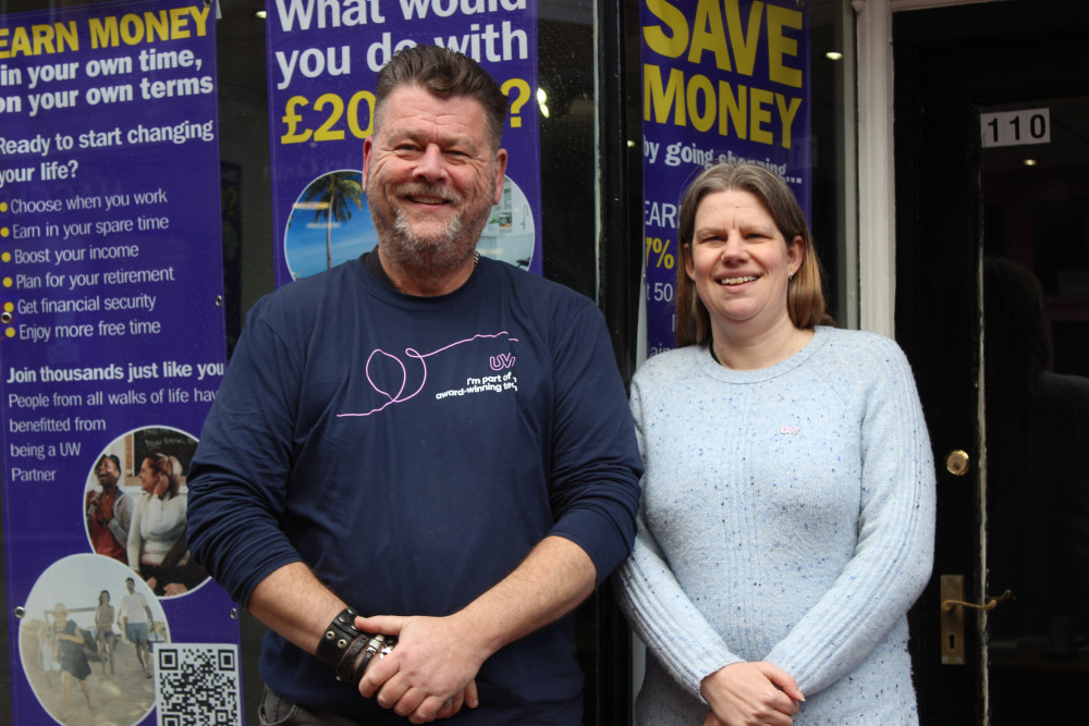 Utility Warehouse offer a service that helps people save money on their bills, offering an alternative way to pay for utilities and more. The parent company will pay Adele (right) and Jonathan (left) for any new customers who sign up. (Image - Alexander Greensmith / Macclesfield Nub News)