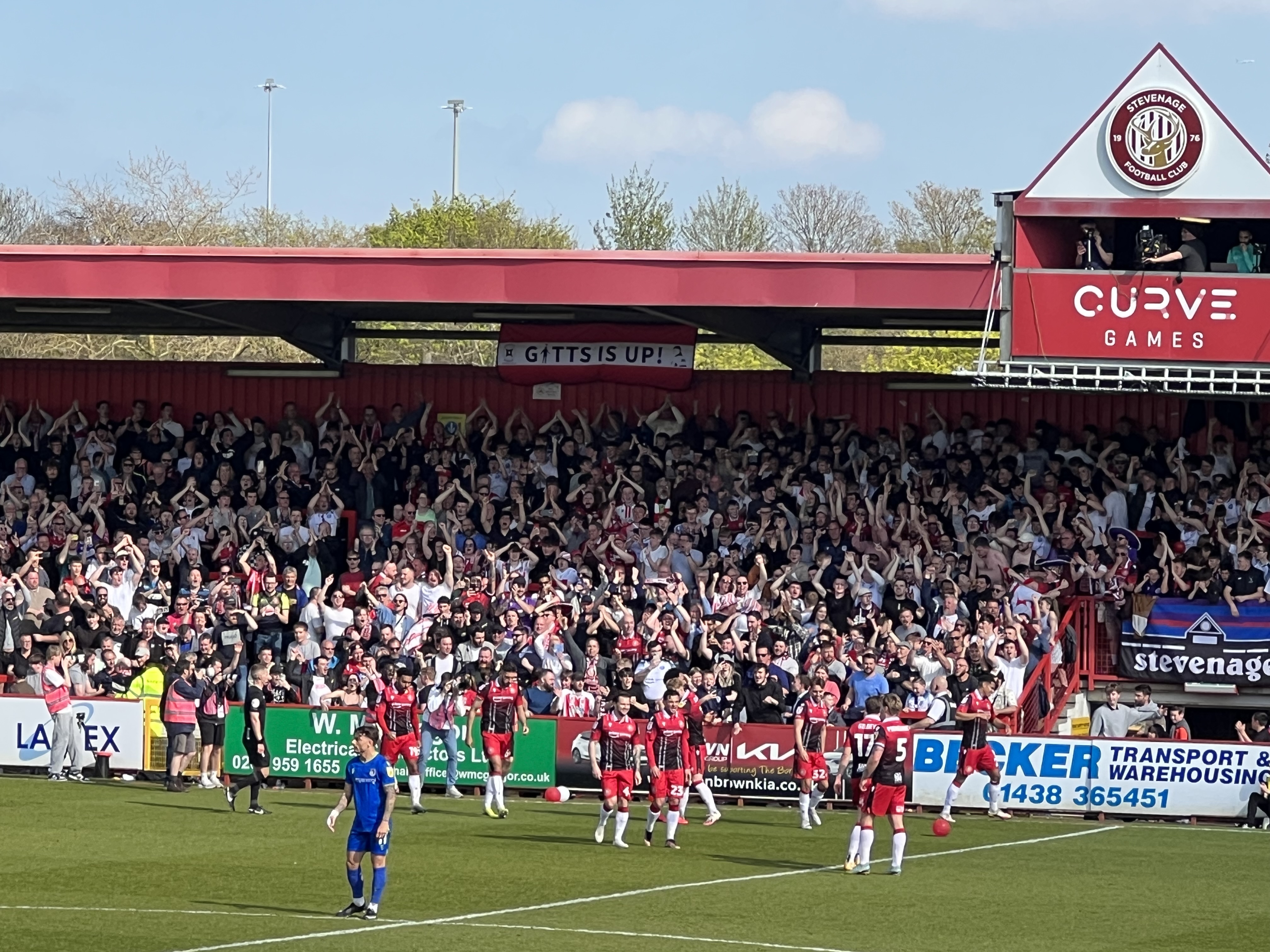 The East Terrace celebrate Luther James Wildin's goal to make it 2-0 to Boro and seal promotion to League One. CREDIT: @laythy29