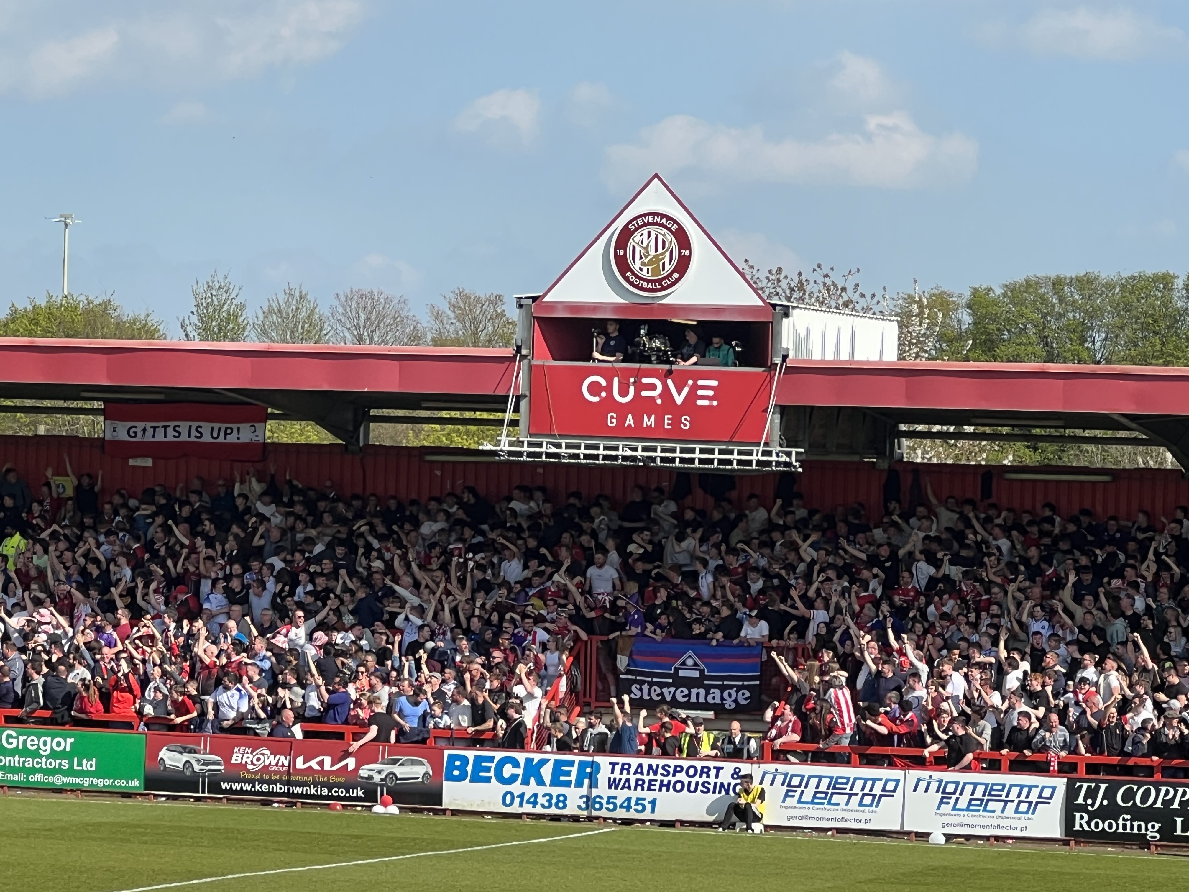 The East Terrace celebrate Luther James Wildin's goal to make it 2-0 to Boro and seal promotion to League One. CREDIT: @laythy29