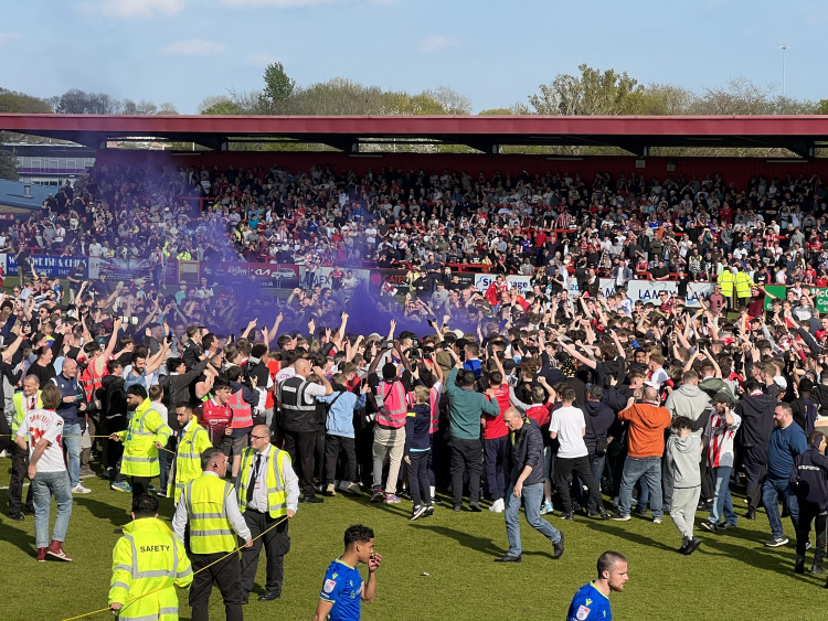 Watch video footage of jubilant scenes at Broadhall Way after Steve Evans Boro are promoted to League One. CREDIT: @laythy29 