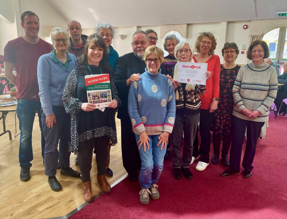 Residents and volunteers from St Vincent de Paul Society celebrating the launch of the new Community Warm Hub with (front L-R) Sue Greenway, WRCC Warm Hubs; and Pauline Hayward, Compassionate Kenilworth (image via WRCC)