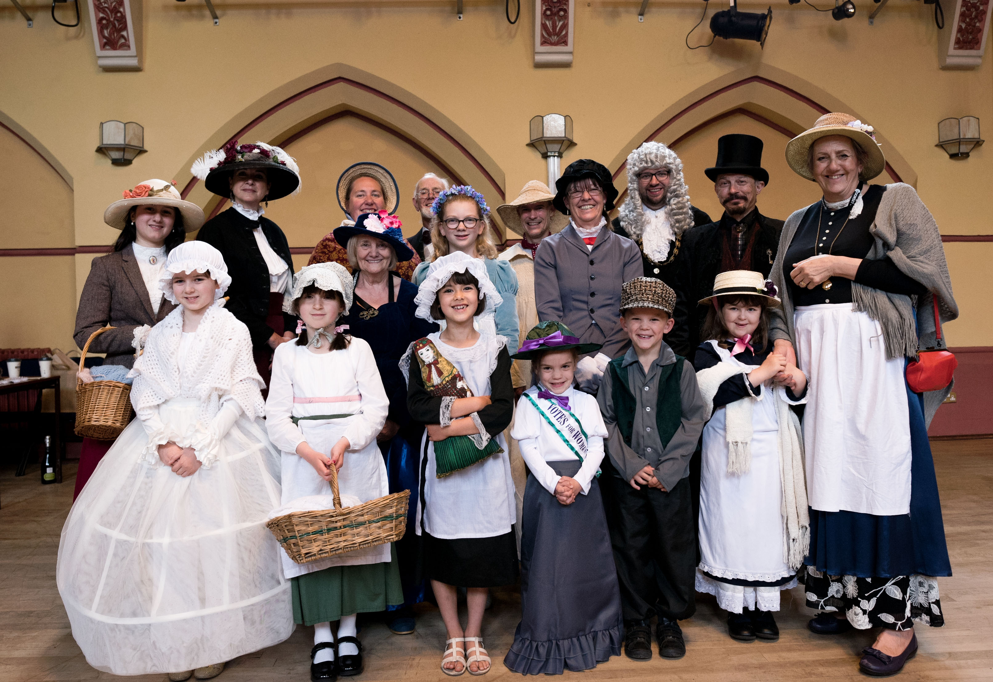 Fair-goers in Victorian costumes at Dorchester Corn Exchange